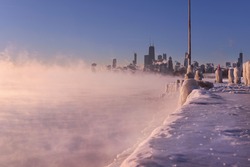 A landscape photo of the Chicago skyline during the polar vortex storming across Lake Michigan. 