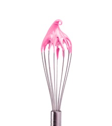 Metal whisk with pink cream isolated on black background. Clipping path.