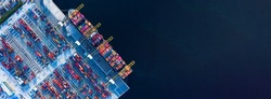 Aerial top view of Container ship loading and unloading, Cargo container in deep seaport for the international order concept. 
