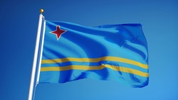 Aruba flag waving against clean blue sky, close up,  