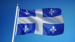 Quebec flag waving against clean blue sky, close up, isolated with clipping path mask alpha channel transparency