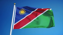 Namibia flag waving against clean blue sky, close up, isolated with clipping path mask alpha channel transparency