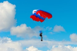 Skydiver - pilot lands on a parachute, sports training in a parachute school, active lifestyle.
