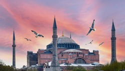 Hagia Sophia is an ancient religion symbol of Istanbul at sunrise. Ayasofya was the greatest Christian temple of Byzantium Empire. Famous Turkish Mosque with foth minarets and birds over the dome.