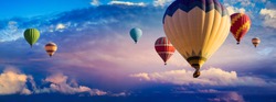 Hot Air Balloon Ride at sunrise background for wide banner of travel agency or adventure tour. Morning hot-air balloon flight with beautiful clouds. Romance of ballooning in a good weather.