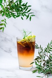 cold cocktail with apple and cola, iced layered coffee drink in cup, Cocktail with cola, apples and whiskey