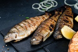 grilled trout barbecue, Baked trout fish, Grilled trout barbeque with lemon, Healthy eating concept