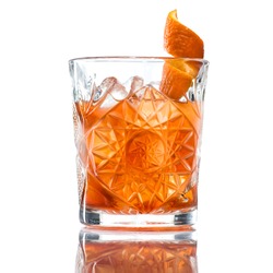 Alcoholic cocktail of the Godfather with orange peel and ice, isolated on white background