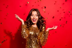 Careless, carefree, dream, dreamy concept. Beautiful, attractive, pretty, charming, modern wave hairstyle lady look at camera with raised hands up and open mouth isolated on shine red background