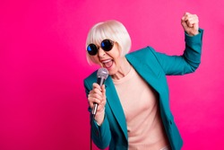 Portrait of her she nice-looking attractive lovely cheerful gray-haired lady singing cool hit spending weekend isolated on bright vivid shine vibrant pink fuchsia color background