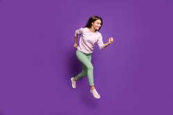 Full length body size view of her she nice attractive charming lovely winsome slim fit thin cheerful girl jumping running isolated over bright vivid shine vibrant purple violet lilac color background