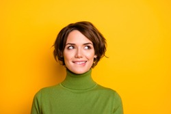 Closeup photo of funny pretty lady charming smiling good mood looking side empty space biting lips wear casual green warm turtleneck isolated yellow color background