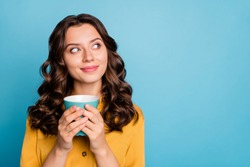 Close-up portrait of her she nice attractive cheery dreamy curious feminine wavy-haired girl holding in hands drinking latte isolated on bight vivid shine vibrant green blue turquoise color background