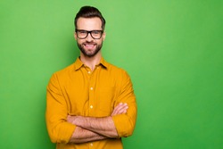 Close-up portrait of his he nice attractive cheerful cheery bearded guy in casual formal shirt office employee folded arms isolated on bright vivid shine vibrant green color background