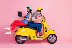 Full length photo of positive cheerful two people bikers drive yellow chopper woman sit backside browse internet navigate route isolated over pastel color background