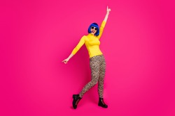 Full body photo of funny lady dancing moves students theme party wear specs yellow turtleneck blue bob wig boots leopard trousers isolated vivid pink color background