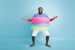 Omg dude its you. Full size photo positive crazy barefoot afro american guy enjoy leisure holiday have buoys want hug friend wear striped vest white shorts isolated blue color background