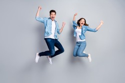 Full body photo of attractive lady handsome funny guy crazy fan jumping high up celebrating football team winning wear casual denim shirts outfit isolated grey color background