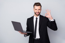 Portrait of confident smart entrepreneur man hold computer work project approve show okay sign wear formalwear outfit isolated over grey color background