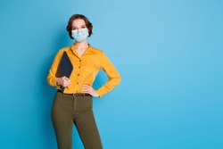 Portrait of her she pretty content lady wearing casual gauze mask carrying laptop coworking home-based office pandemia isolated on bright vivid shine vibrant blue color background