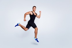 Full length body size view of nice attractive strong sportive muscular cheerful cheery proud guy jumping running goal cup champion sprinter isolated over light gray pastel color background