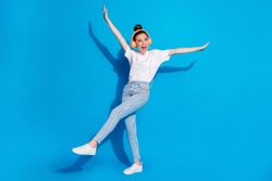 Full length body size view of nice attractive glad cheerful cheery girl dancing listening stereo melody song single pop rock having fun isolated on bright vivid shine vibrant blue color background