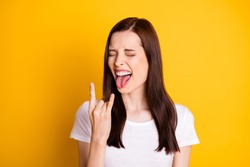 Portrait of crazy punk rocker girl enjoy weekend concert close eyes make horned symbol show tongue-out wear good look outfit isolated over shine color background