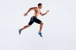 Full length body size view of his he nice attractive professional sportive tall purposeful guy jumping running long distance motivation isolated over light white pastel color background