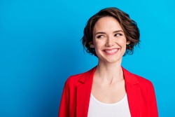 Close-up portrait of nice attractive cheerful brown-haired lady looking aside copy space isolated on bright blue color background