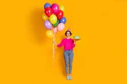 Full length photo of positive girl hold birthday cake hold balloons wear cone pullover isolated bright color background