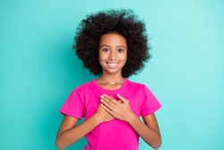 Photo portrait of black skin girl touching chest heart with two hands isolated on vivid cyan colored background