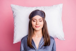 Top above high angle view photo portrait of satisfied woman sleeping on pillow isolated on pastel pink colored background