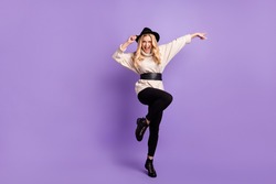 Full body photo of happy charming stunning woman dance hold hat isolated on purple violet color background