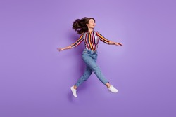 Full length body size photo of woman jumping up childish playful looking copyspace isolated vivid purple color background