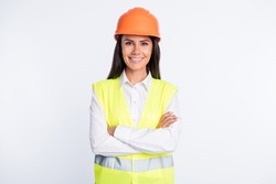 Photo of positive lady folded hands beaming smile wear protective helmet shirt vest isolated white color background