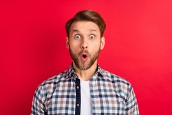 Photo of young handsome man amazed shocked surprised news sale excited isolated over red color background