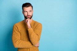 Photo of young attractive handsome thoughtful man thinking look copyspace hold hand chin isolated on blue color background