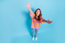 High angle view full body photo of astonished pretty person raise arms up open mouth isolated on blue color background