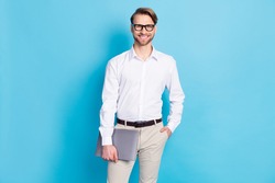 Photo of smart cool happy man hold hand computer pocket wear glasses isolated on blue color background