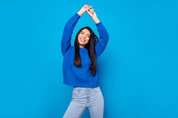 Photo portrait young girl overjoyed dancing wearing casual clothes isolated vibrant blue color background