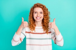 Photo portrait of curly woman smiling showing like thumb-up gesture isolated bright turquoise color background