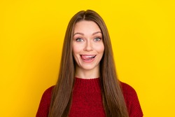 Portrait of attractive funny cheerful long-haired girl licking lip isolated over vibrant yellow color background