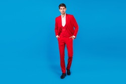 Full length photo of young handsome business man serious confident hands in pocket wear suit isolated over blue color background