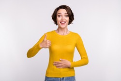 Photo of cool brunette young lady thumb up wear yellow shirt isolated on grey color background