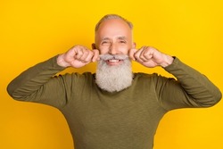 Photo of handsome grandpa touch curly moustaches shiny smile wear green shirt isolated yellow color background