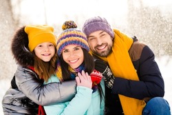 Photo of lovely family happy positive smile hug cuddle embrace enjoy time together winter snowy day outdoors