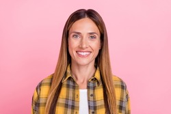 Photo of cheerful happy mature woman smile good mood wear checkered shirt isolated on pastel pink color background
