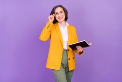 Photo of funny teacher grey aged lady read book wear eyewear yellow jacket isolated on purple color background