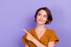 Photo of young woman happy positive smile look indicate finger empty space recommend sale isolated over violet color background