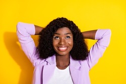 Photo of young happy lovely smiling dreamy afro woman look copyspace relax isolated on yellow color background
